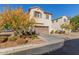 Two-story house with attached garage and autumn landscaping at 3702 E Dogwood Dr, Chandler, AZ 85286