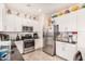 Well-equipped kitchen with stainless steel appliances and white cabinetry at 3702 E Dogwood Dr, Chandler, AZ 85286