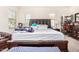 Main bedroom with a king-size bed and dark wood furniture at 3702 E Dogwood Dr, Chandler, AZ 85286