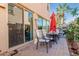 Patio with table, chairs, and red umbrella at 3702 E Dogwood Dr, Chandler, AZ 85286