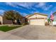 Single story home with a two car garage and landscaped yard at 4106 E Mia Ln, Gilbert, AZ 85298