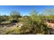 Backyard with desert landscaping and a stone structure at 412 W Siesta Way, Phoenix, AZ 85041