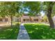 Well-maintained building exterior with landscaping and walkway at 4554 E Paradise Village N Pkwy # 231, Phoenix, AZ 85032