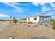 Mobile home exterior with covered porch and mature trees at 9790 N Battleford Dr, Casa Grande, AZ 85122