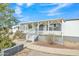 Mobile home exterior with covered porch and steps at 9790 N Battleford Dr, Casa Grande, AZ 85122