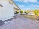 Landscaped backyard with brick patio and covered area at 10018 W Trumbull Rd, Tolleson, AZ 85353