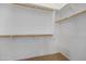 Walk-in closet with double hanging rods and shelving at 10348 W Fernando Dr, Arizona City, AZ 85123