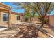 Landscaped backyard with a gravel pathway at 10417 E El Moro Ave, Mesa, AZ 85208