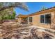 Backyard view of home with covered patio at 10417 E El Moro Ave, Mesa, AZ 85208