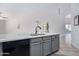 Kitchen island with sink and gray cabinets at 10417 E El Moro Ave, Mesa, AZ 85208