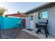 Backyard with grill and partially visible teal wall at 10443 W Butler Dr, Peoria, AZ 85345