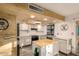 Updated kitchen with white cabinets, butcher block island and wood ceiling at 10443 W Butler Dr, Peoria, AZ 85345