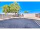 Large backyard with gravel and a mature tree at 10856 E Arcadia Ave, Mesa, AZ 85208