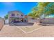 Spacious backyard with gravel and covered patio at 10856 E Arcadia Ave, Mesa, AZ 85208