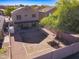 Large backyard with covered patio, storage shed, and a spacious area at 10856 E Arcadia Ave, Mesa, AZ 85208