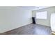 Simple bedroom with wood-look floors and a treadmill at 10856 E Arcadia Ave, Mesa, AZ 85208