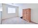 Bright bedroom with dresser and neutral carpet at 10856 E Arcadia Ave, Mesa, AZ 85208