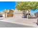 Two-story house with a tan facade and a two-car garage at 10856 E Arcadia Ave, Mesa, AZ 85208
