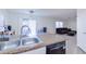 Kitchen features a double sink and modern dishwasher at 10856 E Arcadia Ave, Mesa, AZ 85208