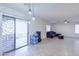 Bright living room featuring tiled floors and access to a patio at 10856 E Arcadia Ave, Mesa, AZ 85208