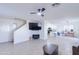 Spacious living room with a ceiling fan and fireplace at 10856 E Arcadia Ave, Mesa, AZ 85208