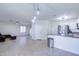 Open living room with tile floors and a view of the kitchen at 10856 E Arcadia Ave, Mesa, AZ 85208