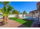 Backyard with a kidney-shaped pool and patio at 11316 W Willow Ln, Avondale, AZ 85392