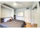 Bedroom with a murphy bed and mirrored closet doors at 127 E Loma Ln, Phoenix, AZ 85020