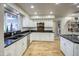 Well-equipped kitchen with white cabinets and granite countertops at 127 E Loma Ln, Phoenix, AZ 85020