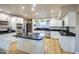 Modern kitchen with large island and stainless steel appliances at 127 E Loma Ln, Phoenix, AZ 85020