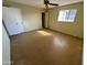 Simple bedroom with a ceiling fan and ample closet space at 1325 E Avalon Dr, Phoenix, AZ 85014