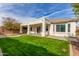 Home exterior and backyard with covered patio at 13737 W Luke Ave, Litchfield Park, AZ 85340