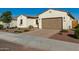 House exterior showcasing a two-car garage and well-maintained landscaping at 16233 S 178Th Dr, Goodyear, AZ 85338