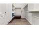 Spacious walk-in closet with built-in shelves and hanging rods at 16233 S 178Th Dr, Goodyear, AZ 85338