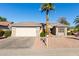 Inviting single-story home with stone accents, a two-car garage, and desert landscaping at 16502 W Arroyo Ct, Surprise, AZ 85374