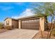 House exterior with brown garage door and driveway at 17830 W Pinnacle Vista Dr, Surprise, AZ 85387