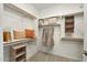 Large walk-in closet with ample shelving and hanging space at 18131 W Sand Hills Dr, Surprise, AZ 85387