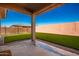 Covered patio overlooking a grassy backyard at 18450 W Elwood St, Goodyear, AZ 85338