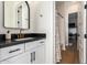 Stylish bathroom with black countertop and gold fixtures at 18450 W Elwood St, Goodyear, AZ 85338