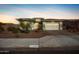 Single-story home with two-car garage and desert landscaping at 18450 W Elwood St, Goodyear, AZ 85338