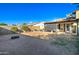 Large backyard with covered patio and fire pit at 2421 E Dragoon Ave, Mesa, AZ 85204