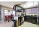 Modern kitchen with dark cabinetry and an island at 2421 E Dragoon Ave, Mesa, AZ 85204