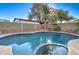 Private kidney-shaped pool with a spa and lush landscaping at 2421 E Dragoon Ave, Mesa, AZ 85204