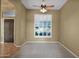 Home office with ceiling fan, plantation shutters, and wood-look floors at 3331 E Indigo Cir, Mesa, AZ 85213