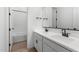 Modern bathroom with double vanity, neutral colors, and a bathtub at 37730 W Padilla St, Maricopa, AZ 85138