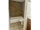 Bathroom with shower/tub combo and tile surround at 3845 E Greenway Rd # 124, Phoenix, AZ 85032