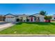 Charming single story home with a well-manicured lawn and attached garage at 4035 E Indianola Ave, Phoenix, AZ 85018