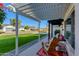 Relaxing front porch with pergola, seating, and view of the street at 4035 E Indianola Ave, Phoenix, AZ 85018