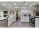 Well-equipped kitchen boasting white cabinets and a spacious island at 4035 E Indianola Ave, Phoenix, AZ 85018