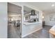 Modern kitchen with white cabinets, quartz countertops, and stainless steel appliances at 4035 E Indianola Ave, Phoenix, AZ 85018